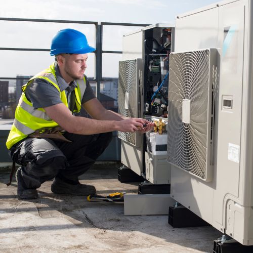 man installing an air conditioning unit