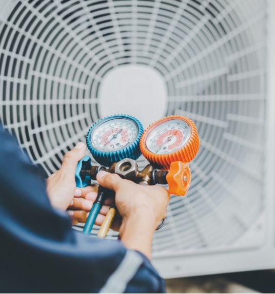 man servicing air conditioning