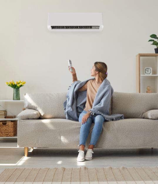 woman using air conditioning in her home